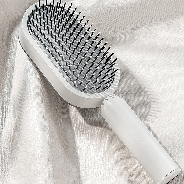 Selbstreinigende Massage-Haarbürste mit Antistatik-Effekt